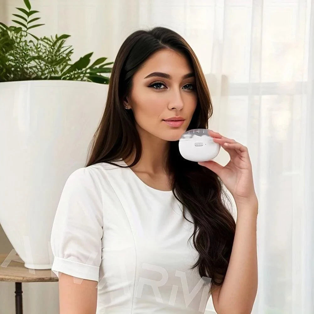 Woman holding compact white electric nail clipper for safe and effortless nail trimming